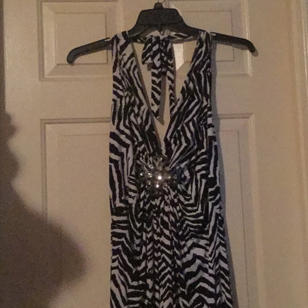 Sleeveless blouse with jeweled decorations